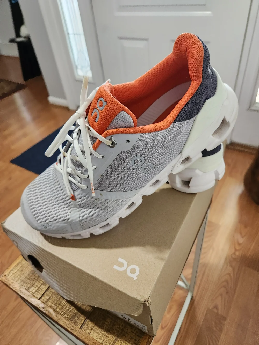 On Running Men’s White and Orange Cloudswift Running Shoes